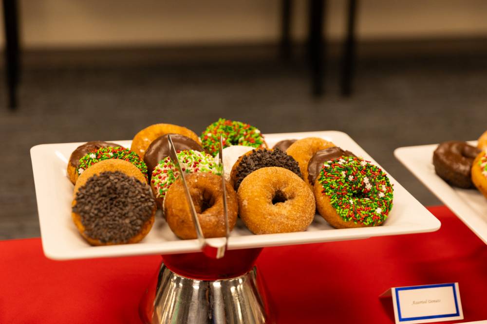 a table of donuts with different frosting